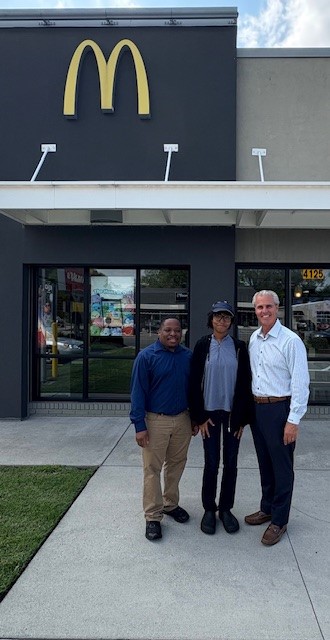 McDonalds employee and scholarship recipient with owner Mike Meoloi.